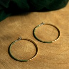 Pure titanium hoop earrings with avocado green and gold glass beads