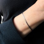 Thin steel bracelet with hematite beads
